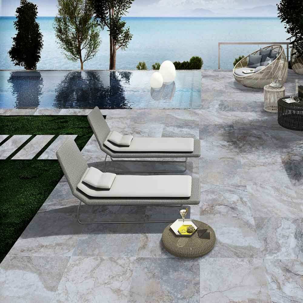 Outdoor Living 2026: Travertine vs. Porcelain Pavers
